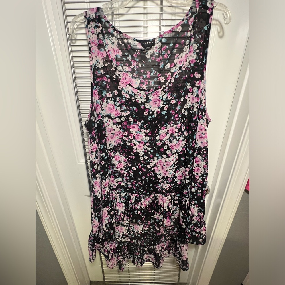 Black floral high-low sheer tank with ruffle bottom